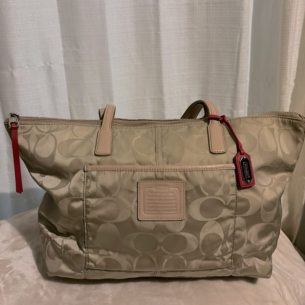 Cream and pink signature Coach bag